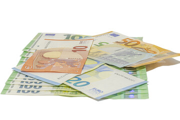 Pile of assorted euro banknotes including one hundred, fifty, twenty, ten and five euro notes scattered on a plain transparent background, studio shot in tilted view, close-up macrophotography.