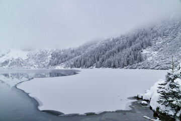 Morskie Oko Lake Covered in Ice at Winter in Tatra Mountains Poland. © ngchiyui