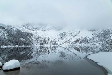 Fototapeta premium Morskie Oko Lake Covered in Ice at Winter in Tatra Mountains Poland.