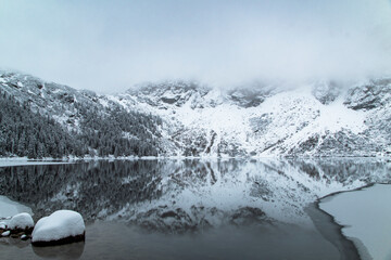Morskie Oko Lake Covered in Ice at Winter in Tatra Mountains Poland. © ngchiyui