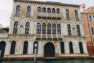 Obraz premium Venetian palazzo architecture standing along a canal in Venice