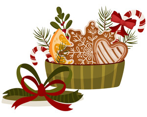 A festive green gift box filled with gingerbread cookies, orange slices, candy canes, holly and pine branches