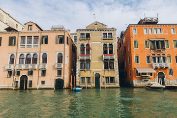 Venice canal scene showing historic colorful buildings and boats