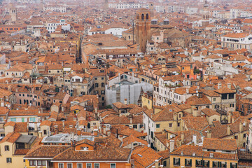Venice cityscape with crowded terracotta rooftops and old buildings