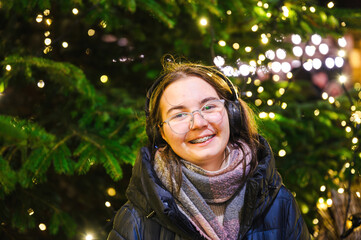 Cheerful Christmas Girl with Festive Lights