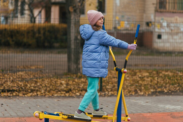 A beautiful, strong teenage girl is involved in sports, fitness on exercise machines, and training...