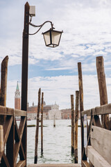 Fototapeta premium Lamppost and dock with San Giorgio Maggiore in Venice