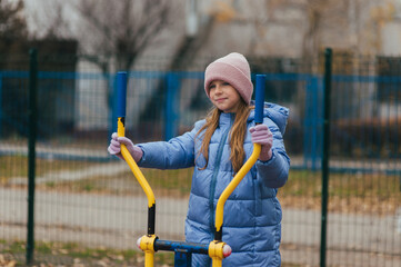 A beautiful, strong teenage girl is involved in sports, fitness on exercise machines, and training...