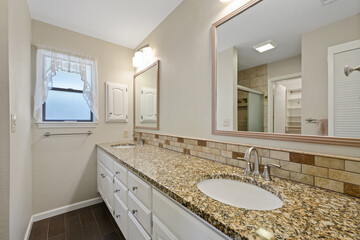 A wellequipped bathroom featuring a toilet, sink, and a bathtub
