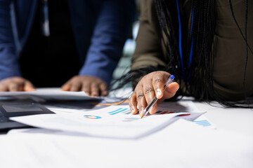 African american team of specialists analysts discuss solar tech manufacturing process development,...