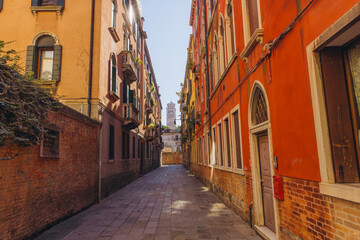 Narrow street alley in Venice Italy with historic architecture