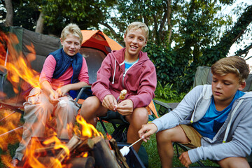 Children, camping and fire with marshmallow outdoor for travel, roasting smores and holiday....