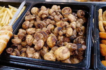 Fried champignon mushrooms. Various foods in fast food restaurant