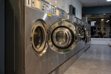 Row of washing machines in Public laundromat