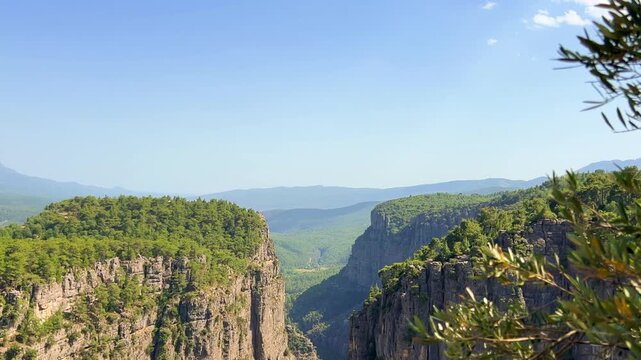 A mountain valley landscape with forests and cliffs. Huge rocks and rocky outcrops. A beautiful deep canyon with lots of tourists. A bird's-eye view of the Tasi Canyon. T&uuml;rkiye	