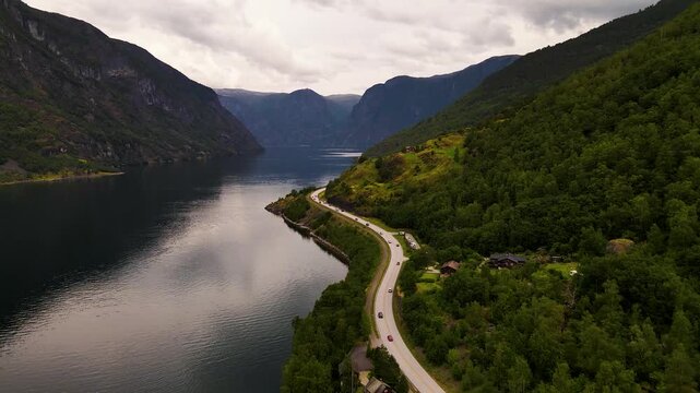 Aerial view of road by water and mountains, Norway.