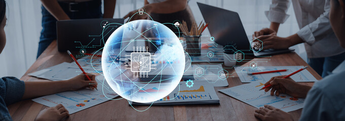 Modern office scene with professionals collaborating on projects. Digital interface overlays illustrate global connectivity and technology innovation concepts. Trope