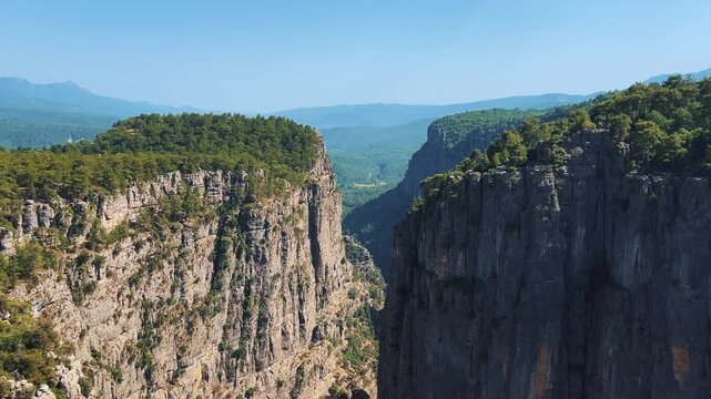 A mountain valley landscape with forests and cliffs. Huge rocks and rocky outcrops. A beautiful deep canyon with lots of tourists. A bird's-eye view of the Tasi Canyon. T&uuml;rkiye	