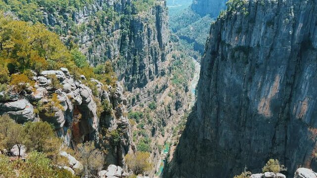 A mountain valley landscape with forests and cliffs. Huge rocks and rocky outcrops. A beautiful deep canyon with lots of tourists. A bird's-eye view of the Tasi Canyon. T&uuml;rkiye
