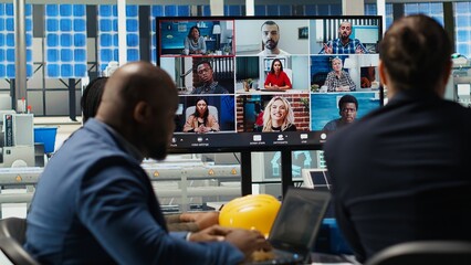 Photovoltaics plant researchers doing internet videocall, working on breakthroughs in durability....