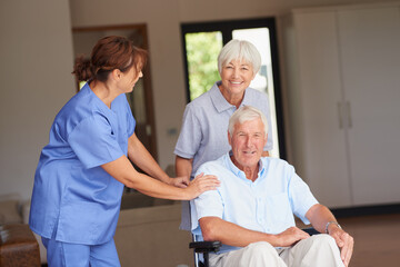 Nurse, old couple and support with wheelchair in home, portrait or happy for recovery in retirement. Elderly woman, caregiver and person with disability, smile and healing for rehabilitation at house