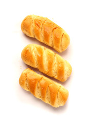 Three French soft and golden brioche rolls on white background. Premium top quality pastry product. Fine and delicate dessert.