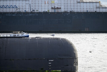 Russian Submarine in the Hamburg Port. Old russian submarine with seagulls at the Hamburg Harbor. Landungsbrücken.