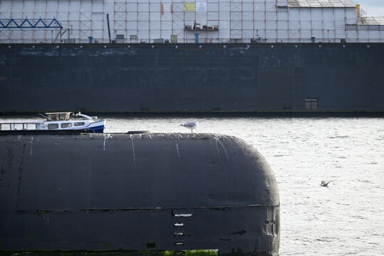 Russian Submarine in the Hamburg Port. Old russian submarine with seagulls at the Hamburg Harbor. Landungsbrücken. - Powered by Adobe