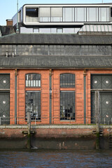 Fototapeta premium Nautic Vessels, Ships and Buildings at Hamburg Landungsbrücken. Fischauktionshalle. Silhouette.