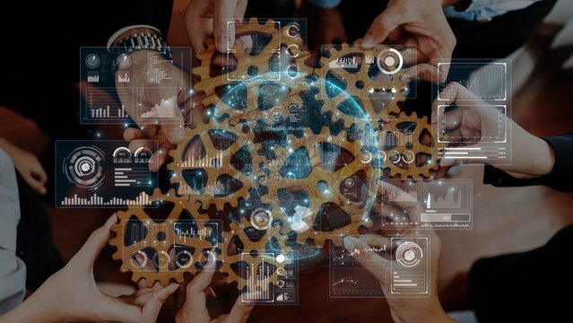 A dynamic representation of teamwork showcasing diverse hands pushing gears, surrounded by futuristic data overlays, highlighting collaboration and innovation in a modern workspace. Raster - Powered by Adobe