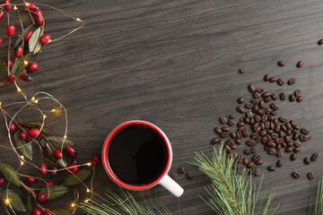 Coffee mug and beans with a Christmas border shot from above