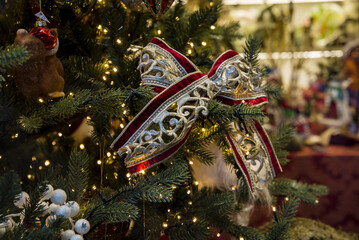 A red Christmas tree bow against a background
