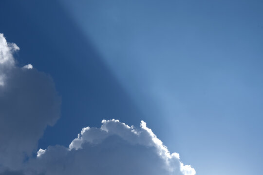 Crepuscular rays is god rays are sunbeams that originate when the Sun appears to be just above or below a layer of clouds - Powered by Adobe