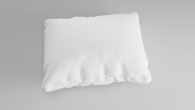 Hard, jagged rock dramatically morphs into a soft, white feather pillow, smoothly rotating and uplifting before gently landing back on its original spot. A visual metaphor for transformation.