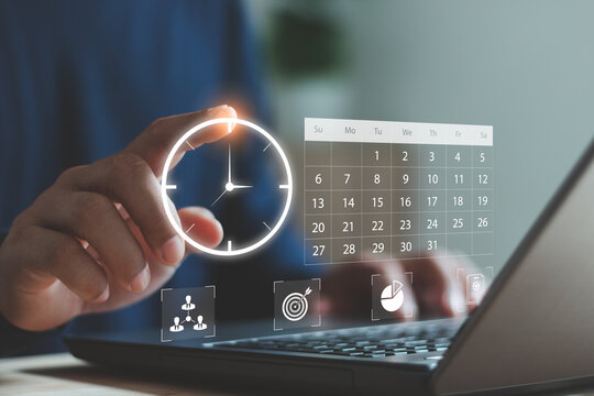 Business person using digital time management and scheduling interface with calendar and task icons on virtual screen, symbolizing productivity, planning and organization in modern digital workflow.