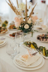 Holiday table setting with sweet favor and flower decor