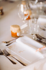 Wedding reception table setting with personalized menu