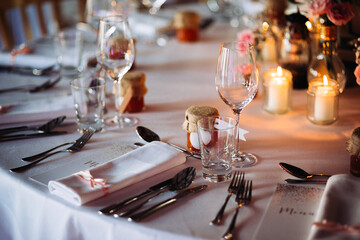 Wedding reception table setting with candlelight and decor