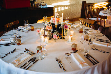 Wedding reception dinner table setting with flowers