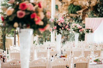 Elegant wedding reception decor featuring floral arrangements