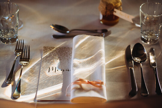 Wedding reception table setup with elegant menu card