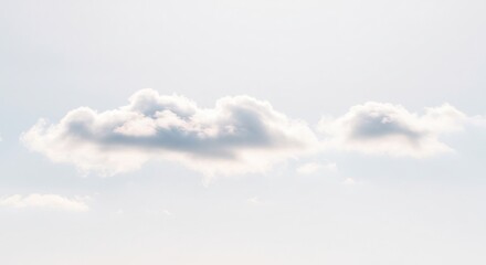 どこまでも澄み渡る淡い青空にたった一つぽつんと浮かぶ純粋で柔らかな白い雲 穏やかで温かい自然光が雲の輪郭を丁寧に照らしその存在感を際立たせる 限りなく広がる空と雲が織りなす静謐で美しい情景. AI Generated