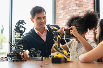 Teacher and Student Exploring Virtual Reality in a STEM Class, Young Girl Holding VR Headset While Learning Robotics and Technology, Technology in Education