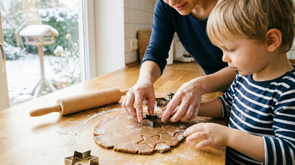 Mother and son making cookies together in a warm kitchen with winter view, family time activity