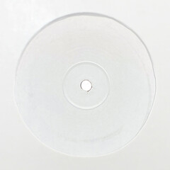 vinyl record with blank label and white sleeve