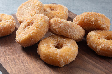 A view of a pile of gluten-free apple cider mini donuts.