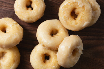 A top down view of some gluten-free old-fashioned glazed mini donuts.
