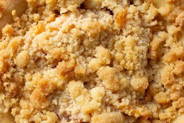 A top down view of a gluten-free, dairy-free mini southern peach pie, as a background.