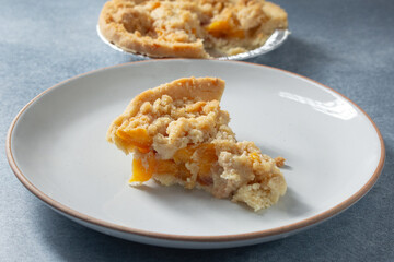 A view of a slice of gluten-free, dairy-free mini southern peach pie.