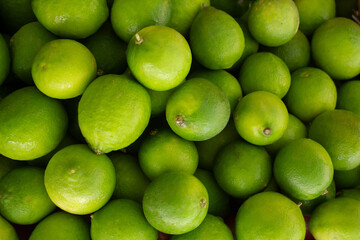 A top down view of a pile of limes, seen at the farmers market.